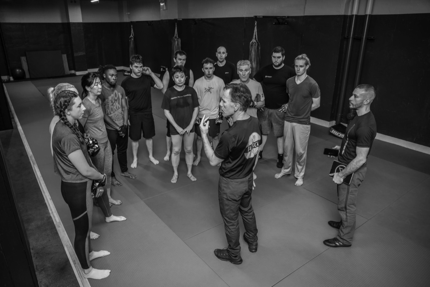 A KMI class gathered around the instructor